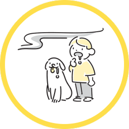 よだれが出ている子供と犬